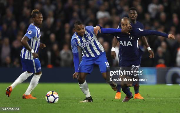 Jose Izquierdo of Brighton and Hove Albion battles for possesion with Lucas Moura of Tottenham Hotspur during the Premier League match between...