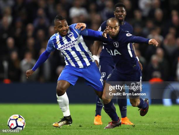 Jose Izquierdo of Brighton and Hove Albion battles for possesion with Lucas Moura of Tottenham Hotspur during the Premier League match between...