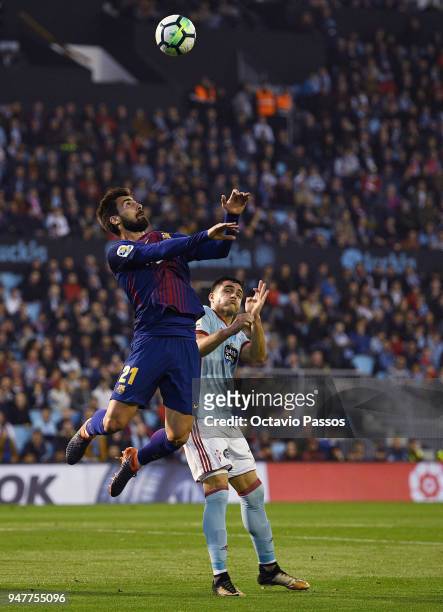 Maxi Gomez of Celta de Vigo competes fo the ball with Andre Gomes of Barcelona during the La Liga match between Celta de Vigo and Barcelona at...