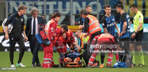 Roberto Gagliardini of FC Internazionale Milano receives medical care during the serie A match between FC Internazionale and Cagliari Calcio at...