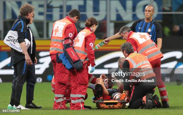 Roberto Gagliardini of FC Internazionale Milano receives medical care during the serie A match between FC Internazionale and Cagliari Calcio at...