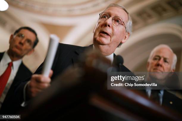 Senate Majority Leader Mitch McConnell talks to reporters with Sen. John Barrasso and Senate Majority Whip John Cornyn following the Senate...