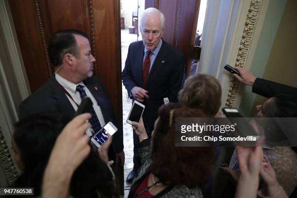 Senate Majority Whip John Cornyn talks with reporters before stepping back into his office at the U.S. Capitol April 17, 2018 in Washington, DC. Vice...