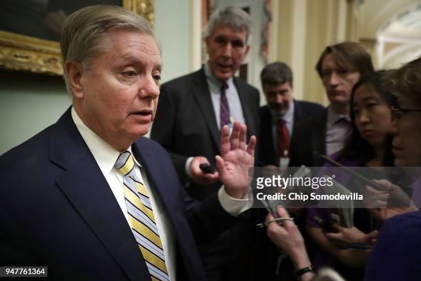 Sen. Lindsey Graham talks with reporters before stepping into the weekly Republican policy luncheon at the U.S. Capitol April 17, 2018 in Washington,...