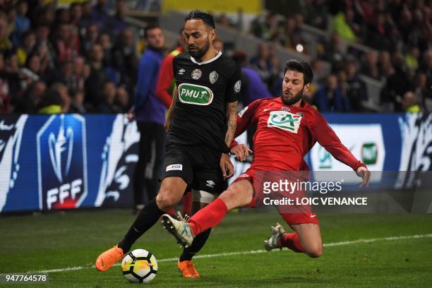 Les Herbiers' Kevin Rocheteau vies with Chambly's Anthony Soubervie during the French Cup semi-final football match between Les Herbiers and Chambly...