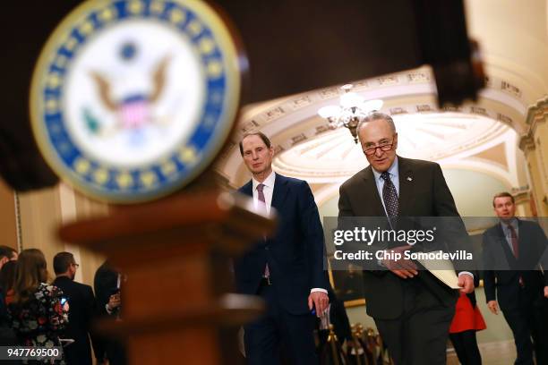 Sen. Ron Wyden , Senate Minority Leader Charles Schumer and Sen. Michael Bennet prepare to talk to reporters following the weekly Democratic policy...