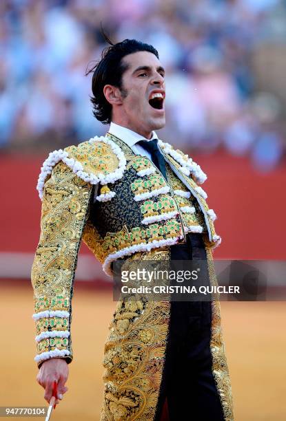 Spanish matador Alejandro Talavante celebrates killing a bull during a bullfight at the Maestranza bullring in Sevilla on April 17, 2018. / AFP PHOTO...