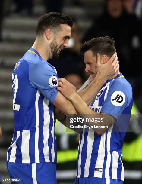 Shane Duffy of Brighton and Hove Albion celebrates with goal score Pascal Gross of Brighton and Hove Albion after he scores his sides first goal from...