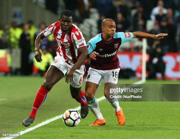 Stoke City's Kurt Zouma takes on West Ham United's Joao Mario during English Premier League match between West Ham United and Stoke City at London...