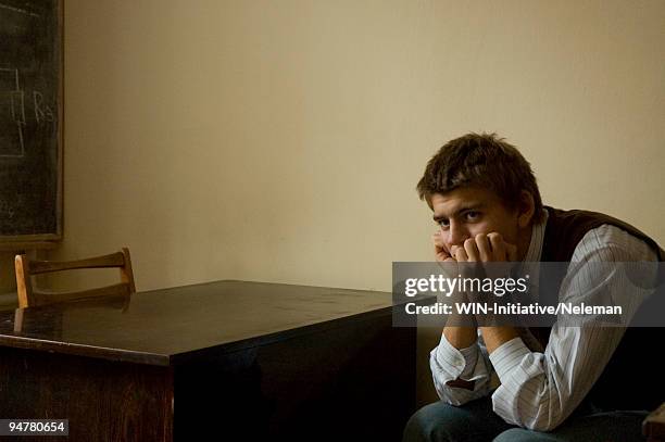 student sitting in serious mood in a classroom, kiev, ukraine - exclusion stock pictures, royalty-free photos & images