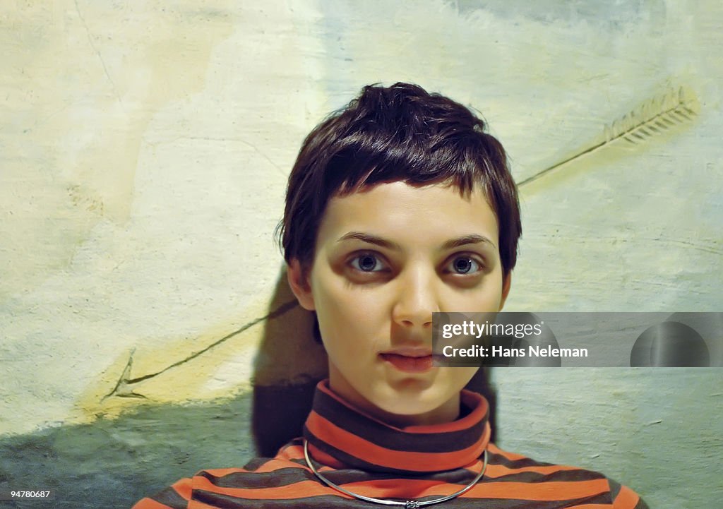 Close-up of a woman leaning against a wall, Kiev, Ukraine