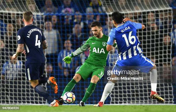 Hugo Lloris of Tottenham Hotspur kicks the ball past Toby Alderweireld of Tottenham Hotspur and Leonardo Ulloa of Brighton and Hove Albion during the...