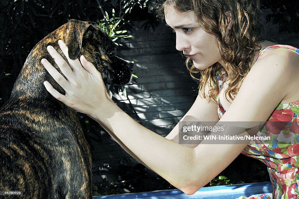 Close-up of a woman stroking her dog