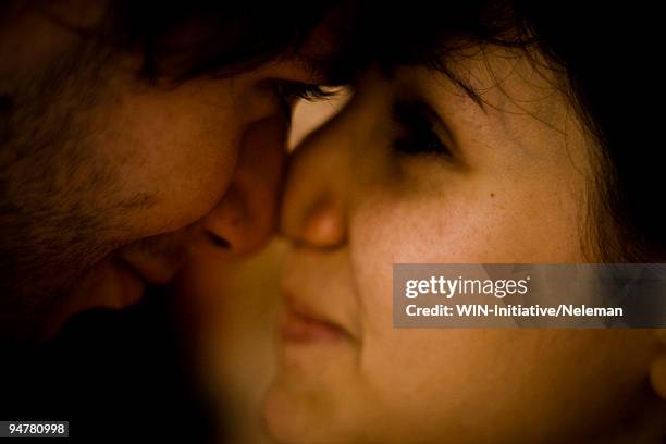 couple rubbing their noses - rubbing noses stock pictures, royalty-free photos & images