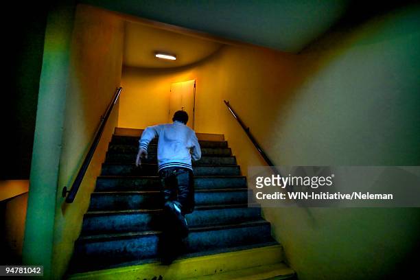 man moving up stairs, argentina - fuggire foto e immagini stock