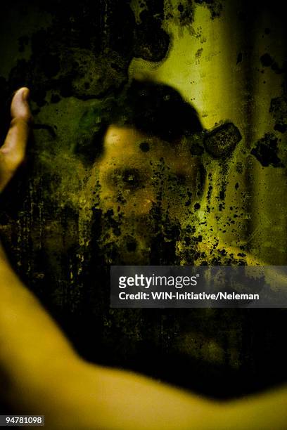 reflection of a man in the bathroom mirror, buenos aires, argentina - broken mirror imagens e fotografias de stock