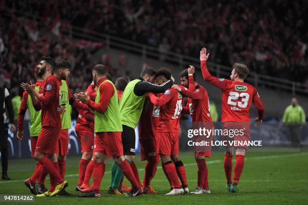 Les Herbier's players celebrate at the end of the French Cup semi-final football match between Les Herbiers and Chambly at the Beaujoire Stadium in...