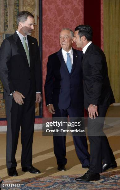 King Felipe VI of Spain , the President of Protugal Marcelo Rebelo de Sousa and Luis Figo attend a reception at El Pardo Palace on April 17, 2018 in...