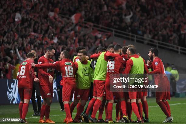 Les Herbier's players celebrate at the end of the French Cup semi-final football match between Les Herbiers and Chambly at the Beaujoire Stadium in...