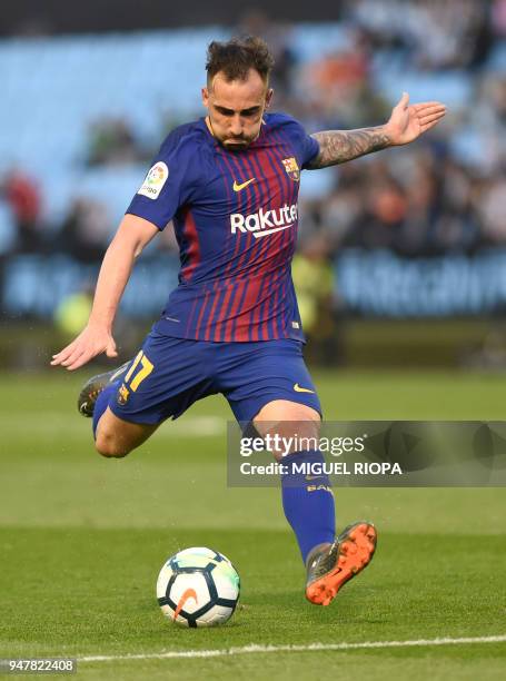 Barcelona's Spanish forward Paco Alcacer kicks the ball during the Spanish league football match between RC Celta de Vigo and FC Barcelona at the...