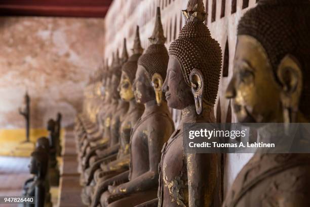 many buddha statues at the wat si saket temple - si saket temple stock pictures, royalty-free photos & images