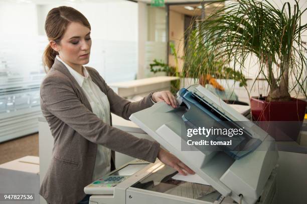 secretary making copies of documents - flat bed scanner stock pictures, royalty-free photos & images