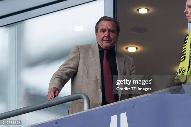 Gerhard Schroeder is on the tribune prior to the Bundesliga match between FC Schalke 04 and Borussia Dortmund at Veltins-Arena on April 15, 2018 in...