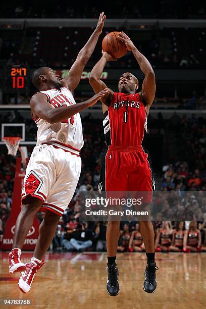 Jarrett Jack of the Toronto Raptors shoots against Lindsey Hunter of the Chicago Bulls during the game on December 5, 2009 at the United Center in...