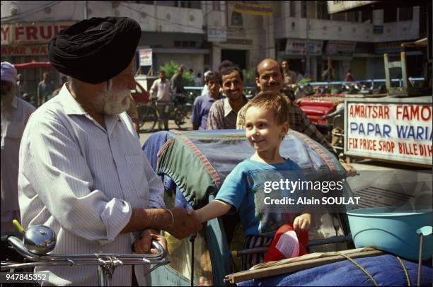 The Sikhs' neatly trimmed beards and stylish turbans make them easily recognizable. .