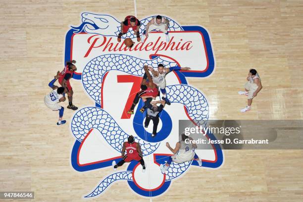 Ben Simmons of the Philadelphia 76ers and Hassan Whiteside of the Miami Heat tip off at the start of the game in Game Two of Round One of the 2018...