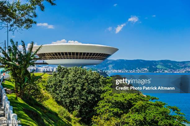 museum of contemporary art rounded building in the city of niterói located across the bay of rio de janeiro, brazil - the niteroi contemporary art museum stock pictures, royalty-free photos & images