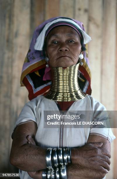 Giraffe woman from the tribe of the Padaung posing for a photo on the one of the small islands of Inle Lake, 2007 in Myanmar.