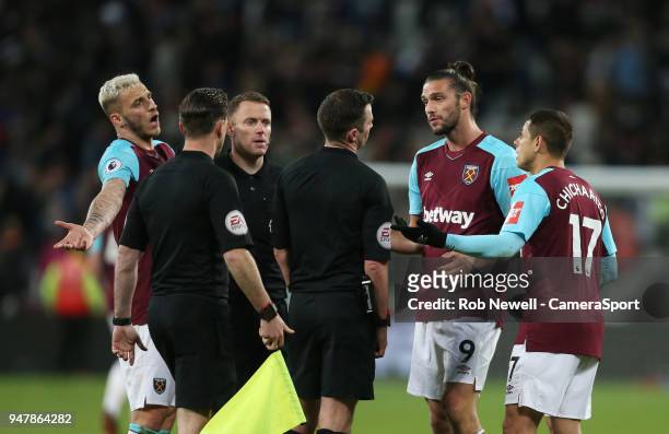 West Ham United's Andy Carroll, Marko Arnautovic and Javier Hernandez surround referee Michael Oliver at the end of the game during the Premier...