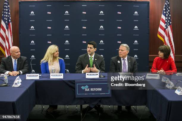 House Speaker Paul Ryan, a Republican from Wisconsin, center, speaks during a round table meeting with American taxpayers on Capitol Hill Washington,...