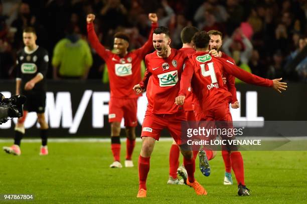 Les Herbiers' players celebrate after winning the French cup semi-final match between Les Herbiers and Chambly at The Beaujoire Stadium in Nantes on...