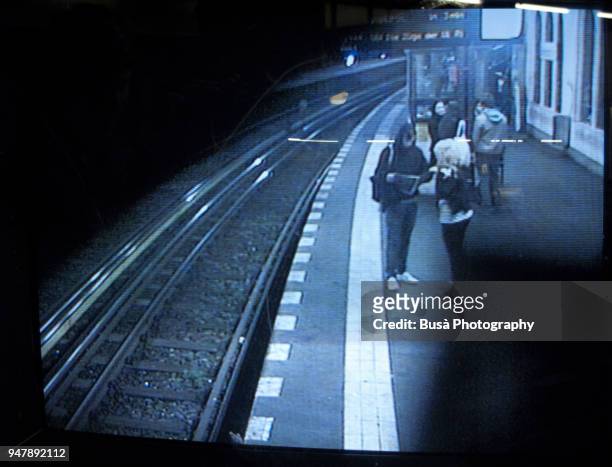 monitor of surveillance camera in subway station in berlin, germany - überwachungskamera stock-fotos und bilder