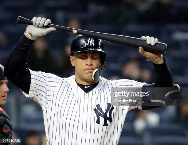 Giancarlo Stanton of the New York Yankees reacts after he hit a pop fly in the third inning against the Miami Marlins at Yankee Stadium on April 17,...