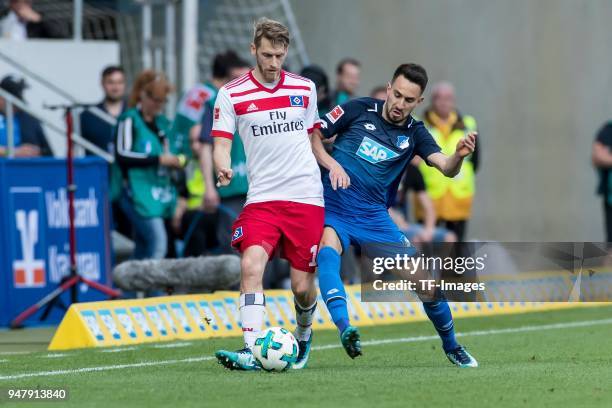 Aaron Hunt of Hamburg and Lukas Rupp of Hoffenheim battle for the ball during the Bundesliga match between TSG 1899 Hoffenheim and Hamburger SV at...