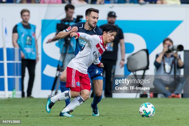 Tatsuya Ito of Hamburg and Lukas Rupp of Hoffenheim battle for the ball during the Bundesliga match between TSG 1899 Hoffenheim and Hamburger SV at...