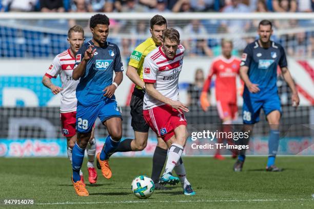 Serge David Gnabry of Hoffenheim and Aaron Hunt of Hamburg battle for the ball during the Bundesliga match between TSG 1899 Hoffenheim and Hamburger...