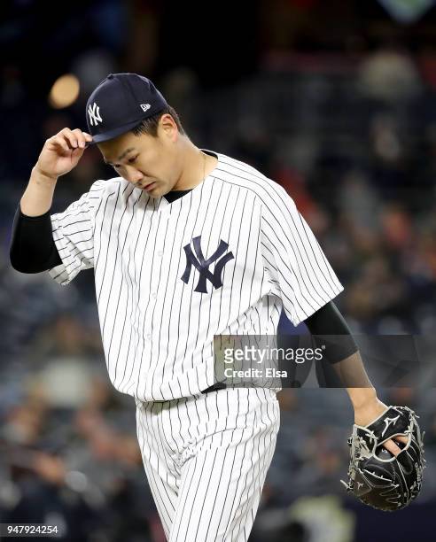 Masahiro Tanaka of the New York Yankees walks off the field after the fifth inning against the Miami Marlins at Yankee Stadium on April 17, 2018 in...