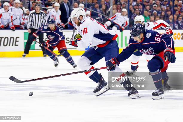 Markus Nutivaara of the Columbus Blue Jackets attempts to steal the puck from Brett Connolly of the Washington Capitals during the first period in...