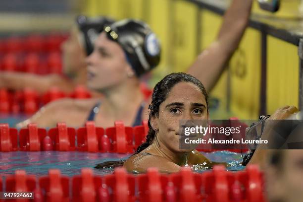 Daynara Ferreira Paula of Brazil looking up after the victory competing in the Women's 100m butterfly final during the Maria Lenk Swimming Trophy...