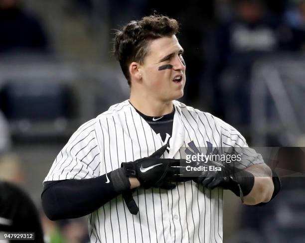 Tyler Austin of the New York Yankees reacts after striking out with bases loaded in the sixth inning against the Miami Marlins at Yankee Stadium on...