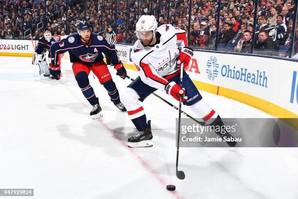Brett Connolly of the Washington Capitals skates with the puck as Seth Jones of the Columbus Blue Jackets defends during the second period in Game...