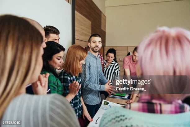 assistant professor debating with students - debate stock pictures, royalty-free photos & images