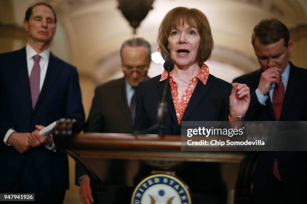Sen. Tina Smith talks with reporters as Sen. Ron Wyden , Senate Minority Leader Charles Schumer and Sen. Michael Bennet following the weekly...