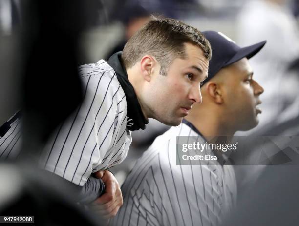 Neil Walker of the New York Yankees looks on from the bench as the New York Yankees lose to the Miami Marlins at Yankee Stadium on April 17, 2018 in...