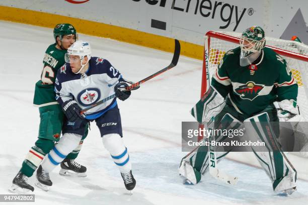 Jared Spurgeon and Devan Dubnyk of the Minnesota Wild defend against Paul Stastny of the Winnipeg Jets in Game Four of the Western Conference First...