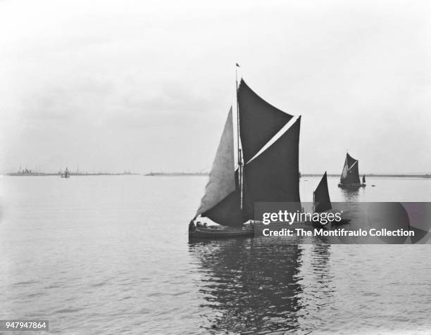 Thames barges on the waters at Sheerness, a town beside the mouth of the River Medway on the north west corner of the Isle of Sheppey, North Kent,...